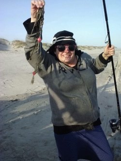 Fish on the Current First-time surf caster Nancy Fisler was very pleased with her catch of seaweed last week. A tug on the line is always a reason to smile.